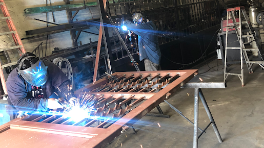 Steel gate fabrication and welding in a North Texas workshop