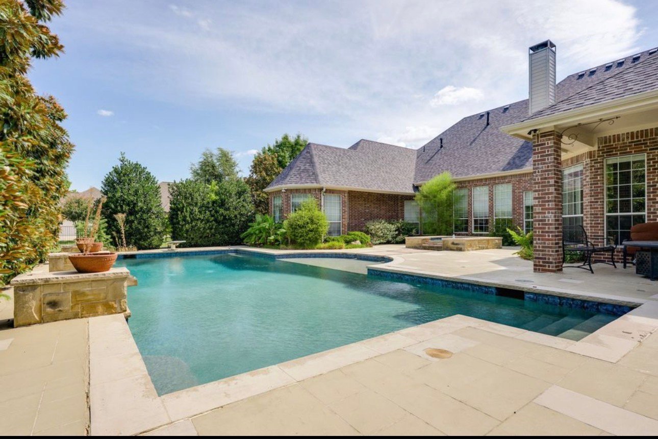 Residential pool before custom metal fence project in Parker TX