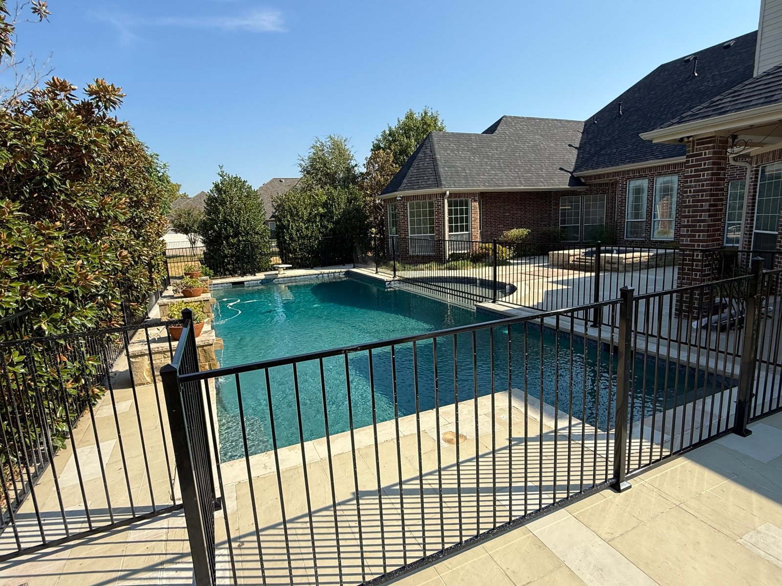 Custom powder-coated metal pool fence gate in Parker TX