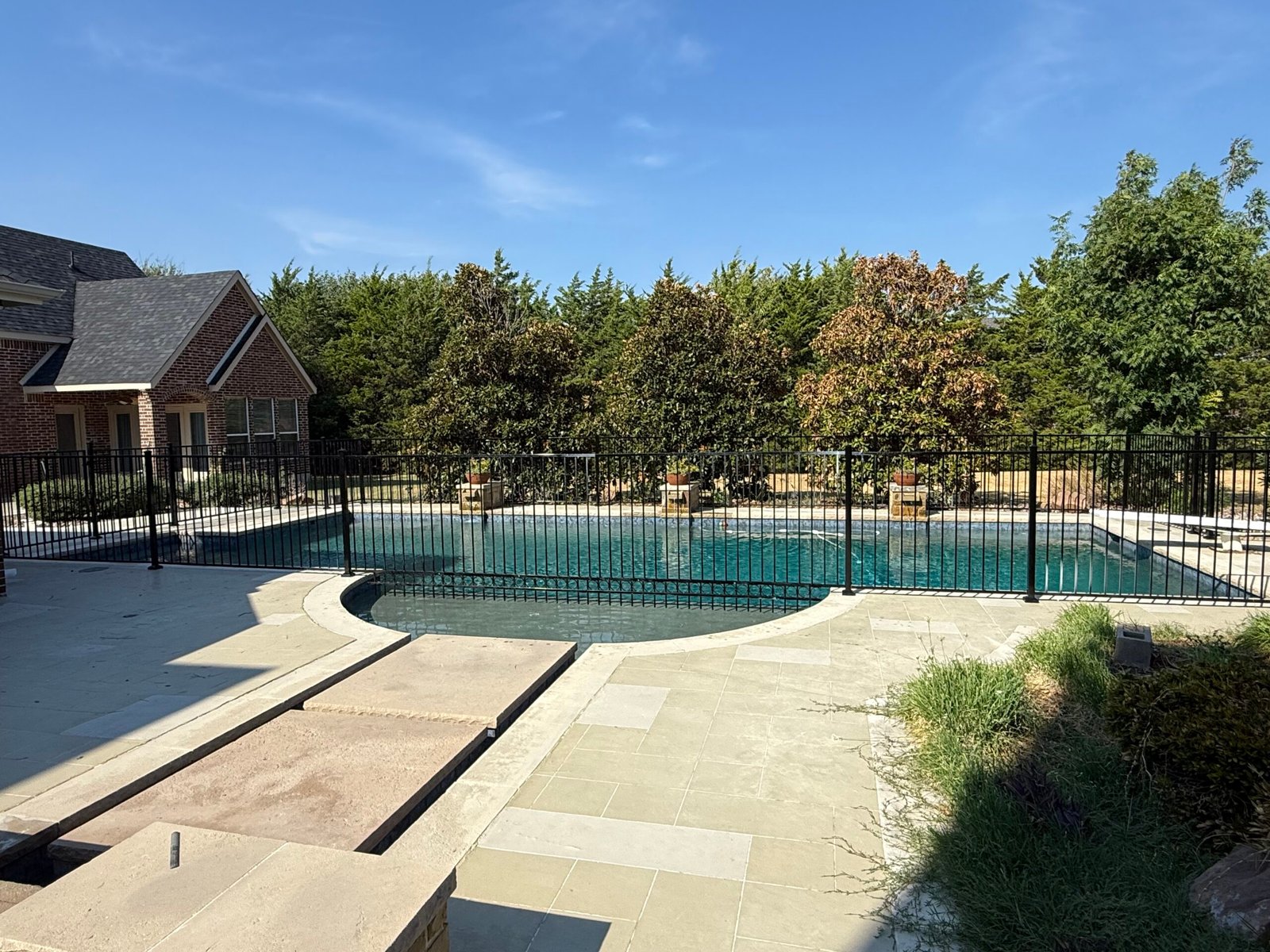 Galvanized powder-coated metal pool fence installation in Parker Texas