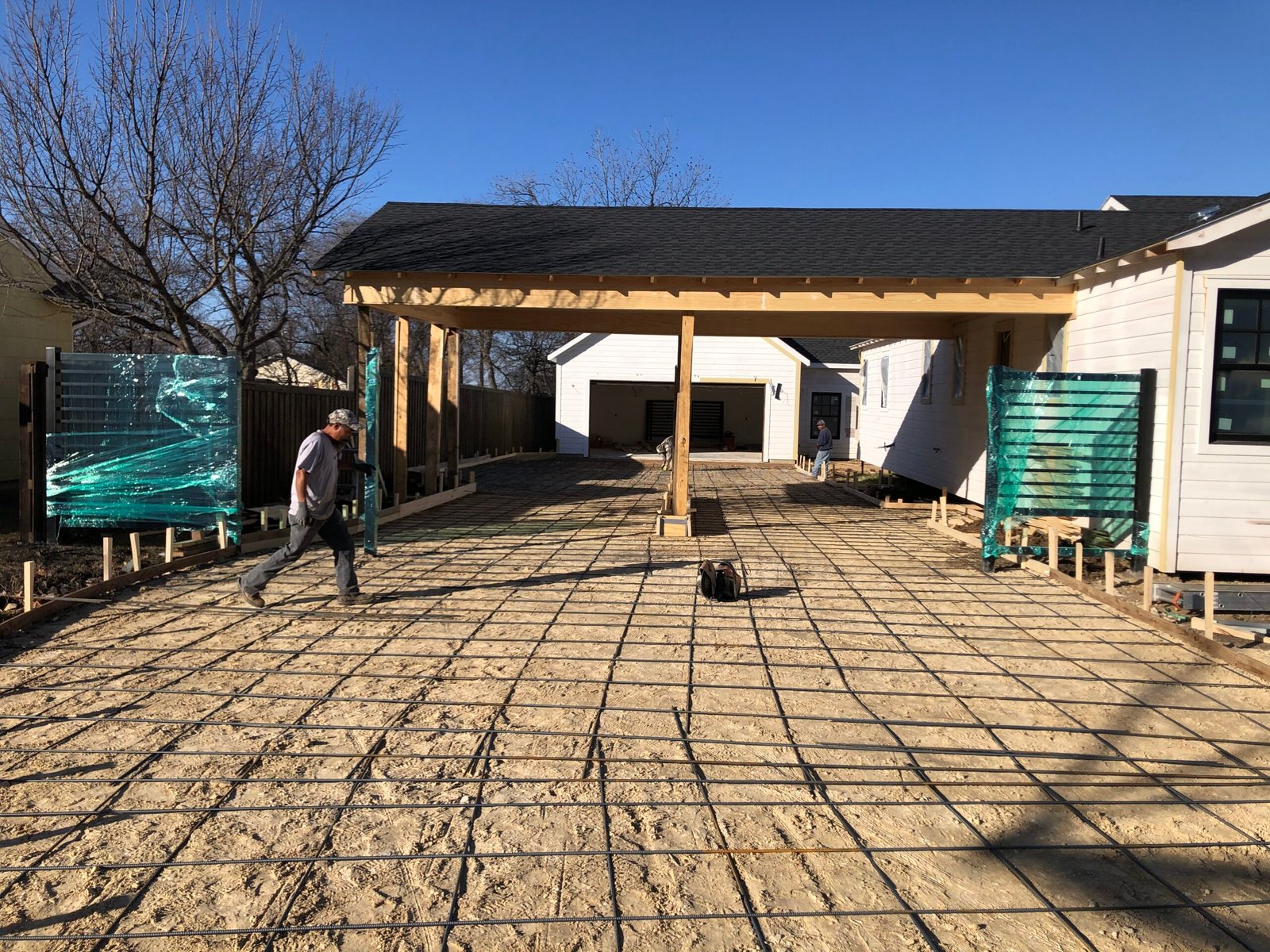 New concrete completed around protected custom driveway gates