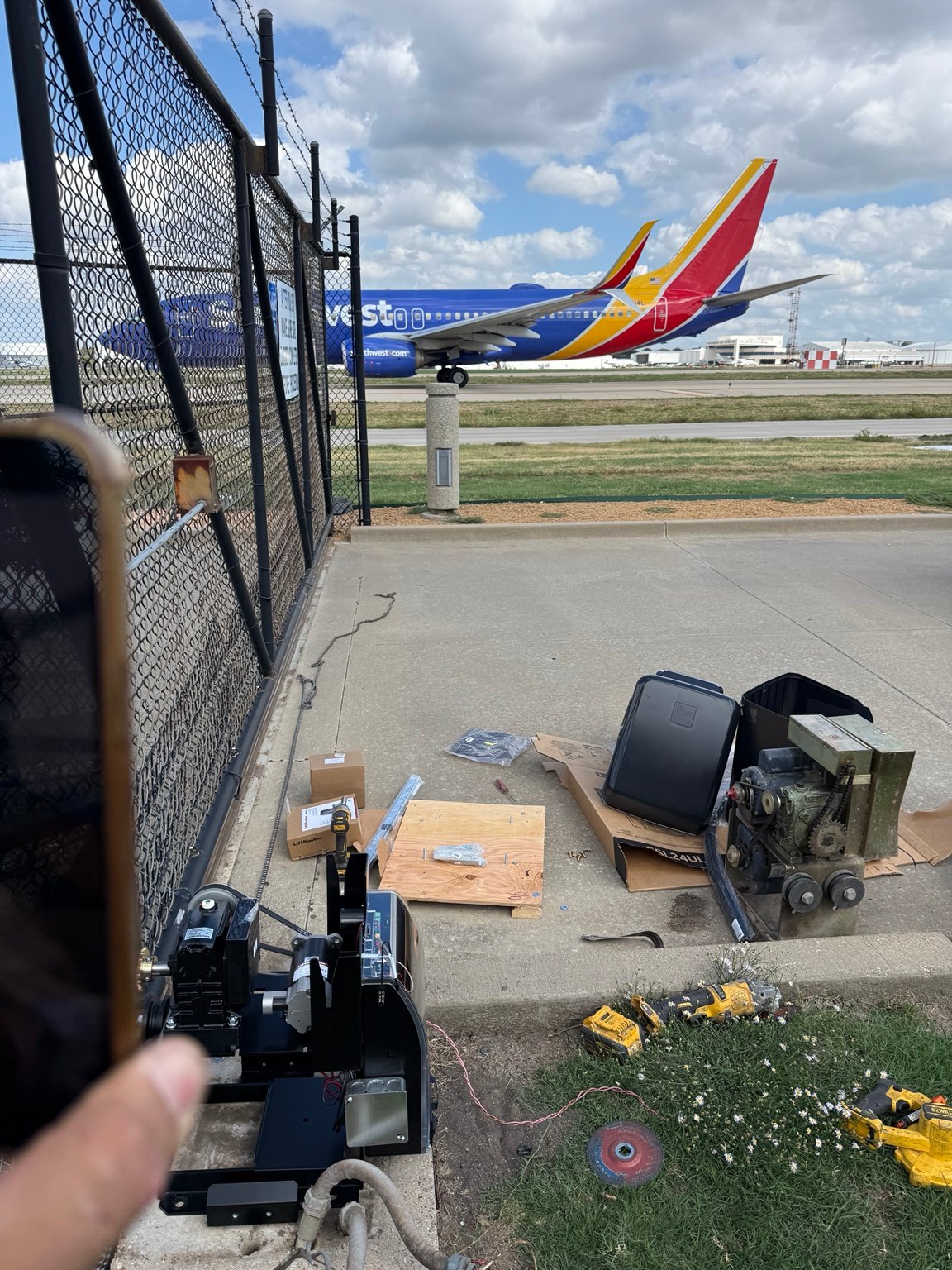 LiftMaster CSL24UL installation in progress beside runway at Dallas Love Field Airport