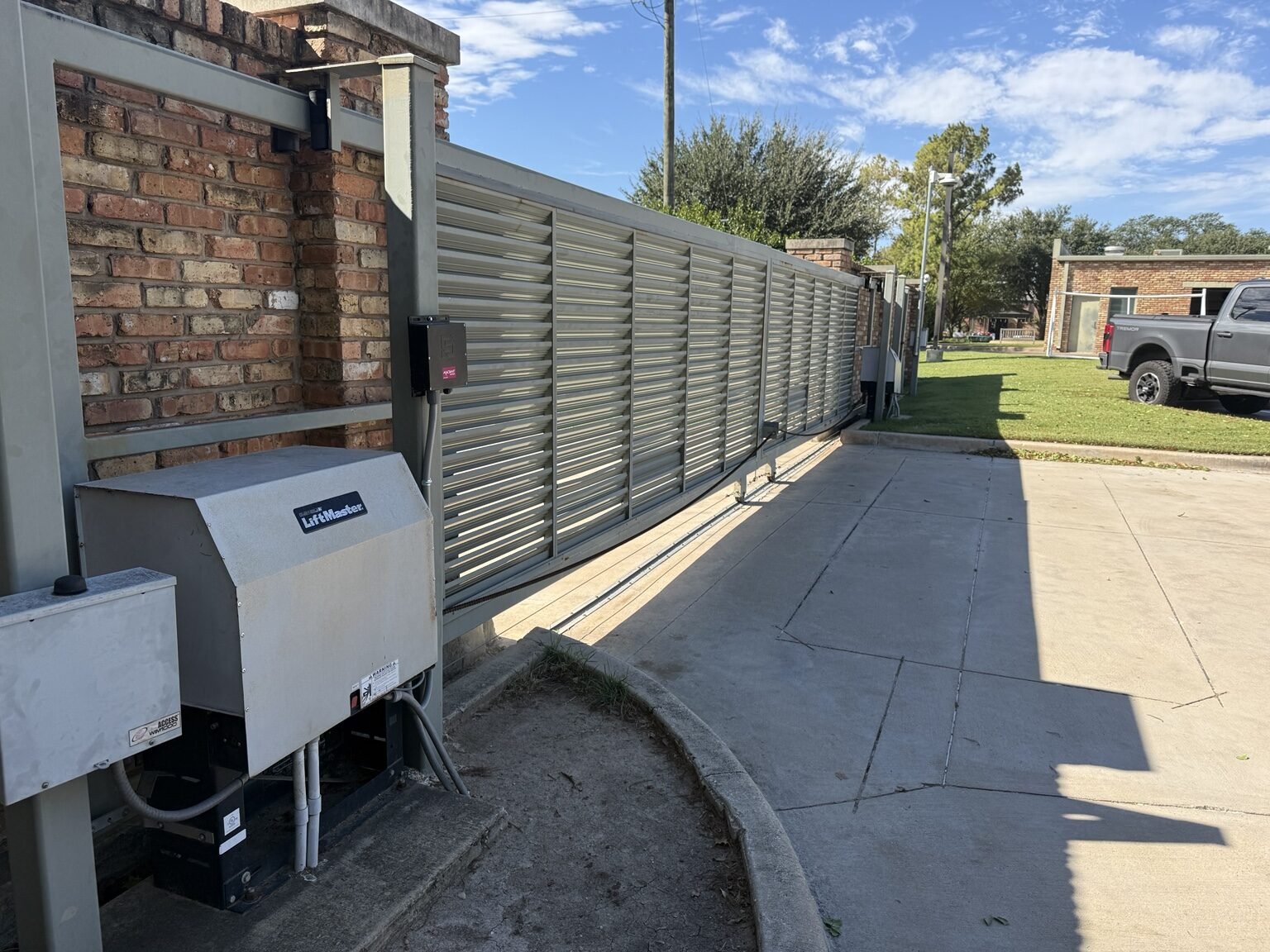Old discontinued LiftMaster sliding gate operator before replacement in Dallas