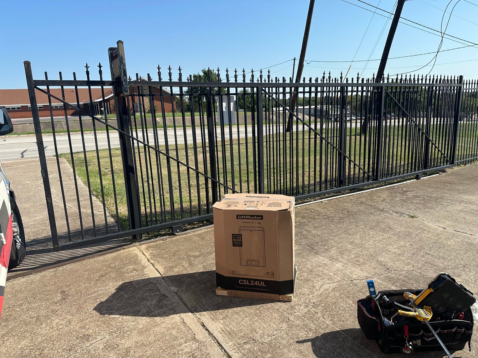 New LiftMaster CSL24UL operator box beside a sliding gate before installation in Watauga